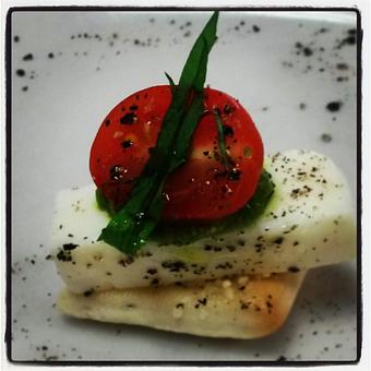 Product: Our house made rosemary foccacia crostinos served with fresh tomatoes, basil and mozzarella cheese, with homemade pesto and extra virgin olive oil. - Aventinos Italian Restaurant in Ridglea Hills North - Fort Worth, TX Italian Restaurants