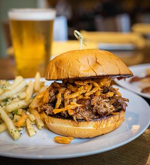 Product: Slow Braised pork shoulder, house bourbon BBQ, crispy onion strings, garlic aioli toasted brioche bun - Back Bistro in Palladio - Folsom, CA American Restaurants