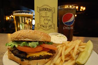 Product: Our delicious half-pound burger, grilled just right. Goes great with French fries, homemade soup, or a side salad. - Barnaby's in East Bank Village Neighborhood - South Bend, IN Italian Restaurants