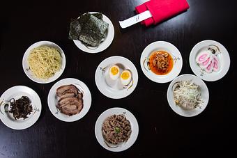 Product: Pork Chashu, Nitamago (Flavored Egg), Naruto (Fish Cake), Sauteed Ground Pork, Kikurage (Black Mushrooms), Extra Noodles, Corn & Butter, Bamboo Shoots, Nori, Chili Oil Paste, Bean Sprouts & Green Onions - Beluga Japanese Restaurant in Round Rock, TX Japanese Restaurants