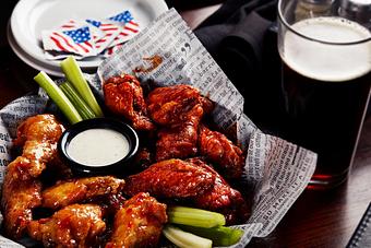 Product: Big Whiskey’s original award-winning jumbo wings are cooked to perfection, tossed in your choice of sauce and served with celery, ranch or bleu cheese. - Big Whiskey's American Restaurant & Bar in Springfield, MO Bars & Grills
