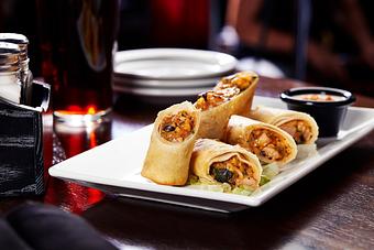 Product: Light and crisp egg rolls stuffed full with chicken, onions, cilantro and bell peppers. Served with Southwestern ranch. - Big Whiskey's American Restaurant & Bar in Springfield, MO Bars & Grills