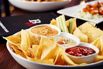 Product: Can’t decide? We can help with 3 of our homemade signature dips — white queso spinach dip, buffalo chicken dip and fresh salsa. - Big Whiskey's American Restaurant & Bar in Springfield, MO Bars & Grills
