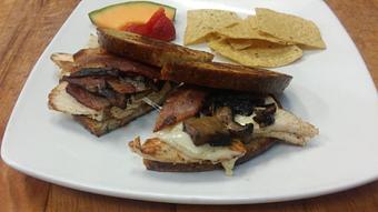 Product: Grilled Chicken with bacon, mushrooms & Swiss. - Blue Heron Cafe & Bakery in Cadillac, MI American Restaurants