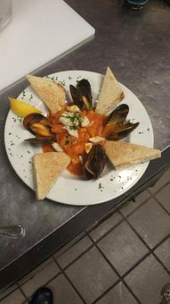 Product: Ciopppino Santa Elena!
 Rockfish filet stewed with tree tomato and wine sauce garnished with Jonah crab claw, mussels and sourdough toast points! Only at the Boatyard!! - Boatyard Bar & Grill in Annapolis, MD American Restaurants
