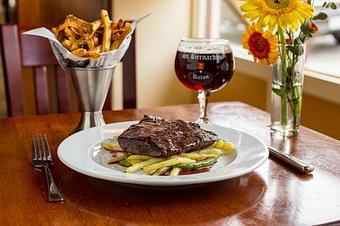 Product: Flat Iron steak in cabernet pan sauce, Frites, roasted market vegetable (during dinner) - Brasserie V in Madison, WI French Restaurants