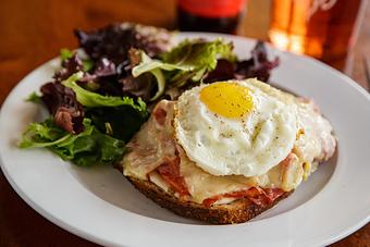 Product: Nueske’s Smoked Ham, Gruyère, Béchamel, Tomato on Madison Sourdough Bread, with choice of Side - Brasserie V in Madison, WI French Restaurants