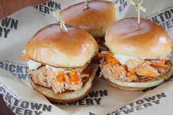 Product: Pulled roasted chicken, Sissy sauce,
bleu cheese aioli, julienned celery and
carrots on slider buns - Bricktown Brewery in Oklahoma City, OK Restaurants/Food & Dining