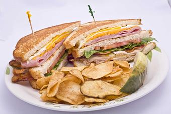 Product: A club on steroids........topped with an egg. - Brunchie's Breakfast Brunch and Lunch in Tampa - Tampa, FL American Restaurants