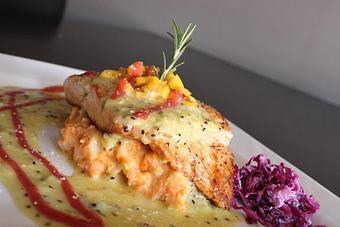 Product: Grilled Salmon topped w/ mango salsa - Cafe Bella in Logan Square - Chicago, IL American Restaurants