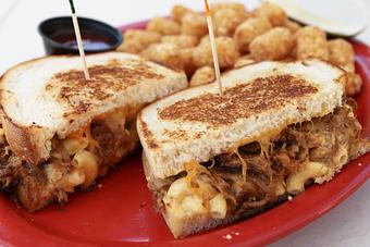 Product: Slow smoked pulled pork, mac-n-cheese & melted cheddar cheese on grilled sourdough - Cali Comfort BBQ in Spring Valley - Spring Valley, CA American Restaurants