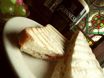 Product: Snack-sized toasted sandwich with meat, cheese, onion, & tomato. - Celtic Ray Irish Pub in Punta Gorda Downtown Historic Distrcy - Punta Gorda, FL Bars & Grills