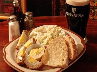 Product: Hard boiled egg wrapped in seasoned Irish sausage meat & baked - Celtic Ray Irish Pub in Punta Gorda Downtown Historic Distrcy - Punta Gorda, FL Bars & Grills