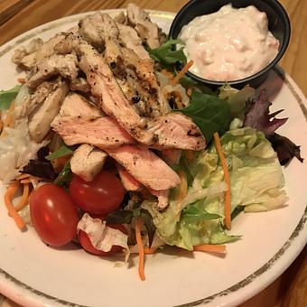 Product: Dinner salad with grilled chicken breast - Charlie Brown's Neighborhood Bar & Grill in San Antonio, TX American Restaurants