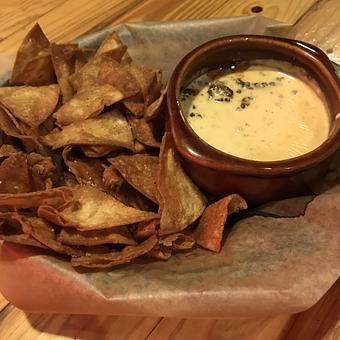 Product: Chips with Queso with optional Beef - Charlie Brown's Neighborhood Bar & Grill in San Antonio, TX American Restaurants