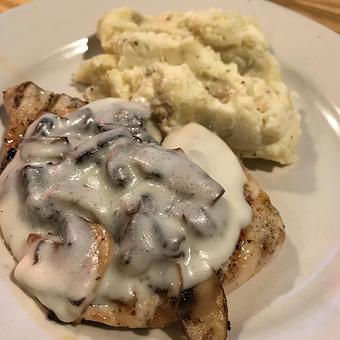 Product: Smothered Chicken - Charlie Brown's Neighborhood Bar & Grill in San Antonio, TX American Restaurants
