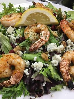 Product: Pictured here is our Broiled Shrimp (cooked bronzed) served on top of a Mediterranean salad - Charlie's Too in Pembroke, MA Seafood Restaurants