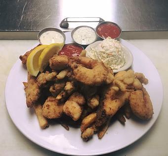 Product: Pictured here is our Fisherman Platter. Included on the plate is Haddock, Whole Clams, Sea Scallops, and Jumbo Shrimp. Served with French Fries and Coleslaw and Tartar and Cocktail Sauces. - Charlie's Too in Pembroke, MA Seafood Restaurants