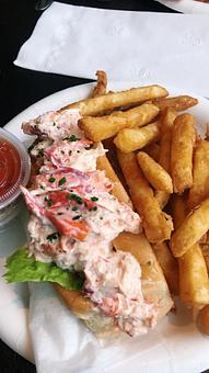 Product: Pictured is our Medium Lobster Roll with French Fries - Charlie's Too in Pembroke, MA Seafood Restaurants