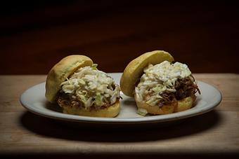 Product: Locally smoked, tangy and tender pulled pork BBQ - Chuck's Steak House in Restaurant Row - Myrtle Beach, SC Steak House Restaurants