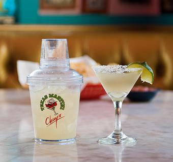 Product: The Texas Martini - shaken, not stirred! Served in an 18oz shaker w/ a salt-rimmed martini glass & hand-stuffed jalapeño olives - Chuy's in Austin, TX Tex Mex Restaurants