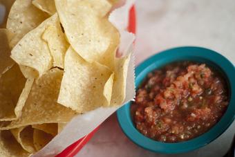 Product: Chips are fried in-house & served w/ Salsa Fresca, made in small batches w/ fresh tomatoes, serrano peppers, and onions - Chuy's in Houston, TX Tex Mex Restaurants