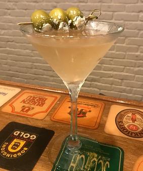 Product: Martini w/ Blue Cheese Stuffed Olives - Coasters Pub & Biergarten in Beachside Melbourne - Melbourne, FL American Restaurants