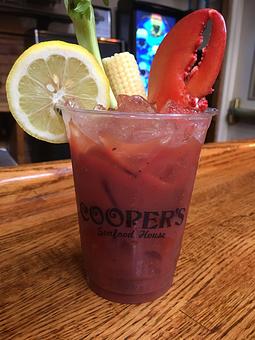Product: Our famous bloody Mary garnished with a lobster claw, celery, lemon and baby corn! - Cooper's Seafood House in Scranton, PA Seafood Restaurants