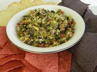 Product: Dg's specialty green chile salsa, made with tomatoes, olives, garlic, jalapenos, green chile, and olive oil - DG's Deli & Market in Albuquerque, NM Delicatessen Restaurants