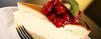 Product: Our "Carnegie Deli" cheese cake made even more scrumptious with cherry topping. - East Bay Deli in Mount Pleasant, SC Delicatessen Restaurants