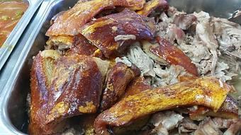 Product: Authentic Puerto Rican Pork dish, marinated overnight and slow cooked to perfection. - El Cerro in Downtown - Clermont, FL Caribbean Restaurants