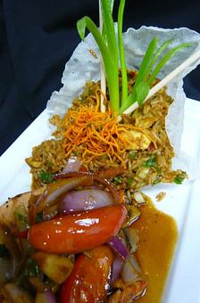 Product: Salmon Saltado - El Chaman Peruvian Restaurant in Miami, FL Latin American Restaurants