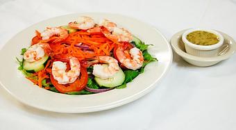 Product: Crisp mixed greens, red onion, cucumber, tomatoes, carrots and bell peppers (added shrimp) - Eugene's Gulf Coast Cuisine in Houston, TX Seafood Restaurants