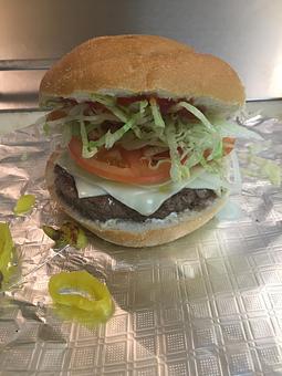 Product: Cheeseburger with lettuce, tomato, onion and hot peppers - Farmer John's Food Market in Hammonton, NJ Delicatessen Restaurants