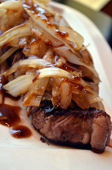 Product: Frank's Style New York Steak - a 10-ounce version of the signature Frank Fat's classic, smothered in sauteed onions and oyster sauce. - Fats Asia Bistro in Folsom - Folsom, CA Chinese Restaurants