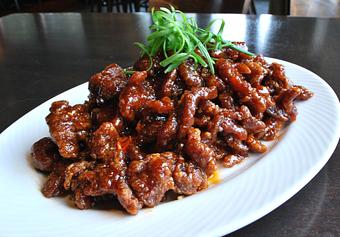 Product: wok-fried flank steak tossed with a zesty Bistro orange sauce - Fats Asia Bistro in Folsom - Folsom, CA Chinese Restaurants