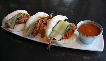 Product: braised pork shoulder and pickled cucumber in a steamed bun, served with mango ketchup - Fats Asia Bistro in Roseville - Roseville, CA Chinese Restaurants