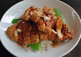 Product: Almond fried chicken, sweet chili-orange sauce, snow peas, steamed rice - Fats Asia Bistro in Roseville - Roseville, CA Chinese Restaurants