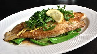 Product: flat grilled basa filet with fresh ginger, green onions and soy oil over snow peas - Fats Asia Bistro in Roseville - Roseville, CA Chinese Restaurants