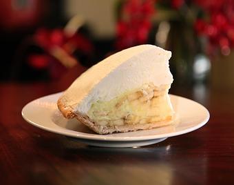 Product: fresh bananas layered in a rich egg custard and flaky crust, topped with fresh whipped cream - Fats Asia Bistro in Roseville - Roseville, CA Chinese Restaurants