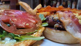 Product: Grain fed beef & gouda burger. - Foothills Brewing in Winston Salem, NC American Restaurants