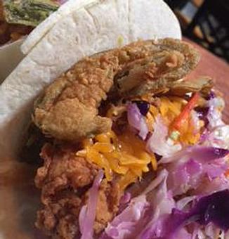Product: Tacos with Chicken Tenders, mustard style bbq sauce, slaw, cheddar cheese and fried jalapeños. - Foothills Brewing in Winston Salem, NC American Restaurants