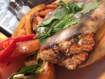 Product: Grilled chicken breast, provolone, roasted red peppers, lettuce, parsley, grilled balsamic tomato & pesto mayo - Foothills Brewing in Winston Salem, NC American Restaurants
