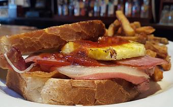 Product: Pan fried bologna, Canadian bacon, Applewood smoked bacon & Hoppyum BBQ - Foothills Brewing in Winston Salem, NC American Restaurants
