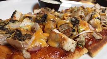 Product: BBQ chicken flatbread with red onion, bacon, cheddar and Jack cheese blend, w/ranch on the side. - Foothills Brewing in Winston Salem, NC American Restaurants