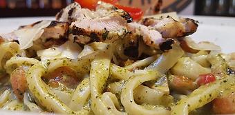 Product: Pasta with pesto cream sauce, topped with grilled chicken. - Foothills Brewing in Winston Salem, NC American Restaurants