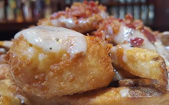 Product: Poutine- French fries, cheese curds, gravy and bacon - Foothills Brewing in Winston Salem, NC American Restaurants