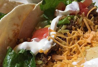 Product: Ground beef, Spanish rice, lettuce, tomato, cheddar and sour cream - Foothills Brewing in Winston Salem, NC American Restaurants