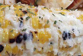 Product: Grilled Mexican sweet corn, smothered in ranch and parmesan, with a drizzle of brewhouse sauce - Foothills Brewing in Winston Salem, NC American Restaurants