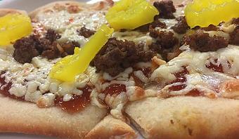 Product: Hoppyum bbq base, pepper jack cheese, chorizo, and banana peppers - Foothills Brewing in Winston Salem, NC American Restaurants